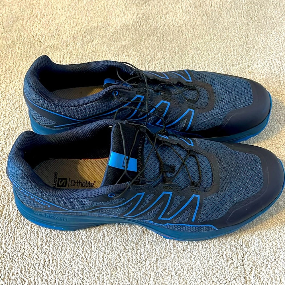 Blue and black Salomon sneakers